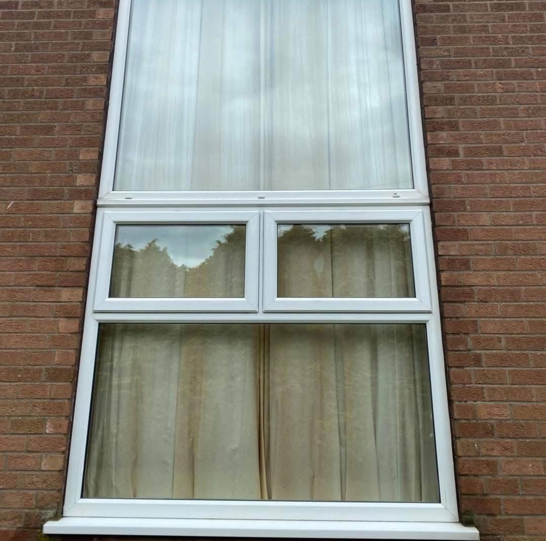 Clean white uPVC window frames on brick house after professional window cleaning by Moonshine Window Cleaning in Lincolnshire